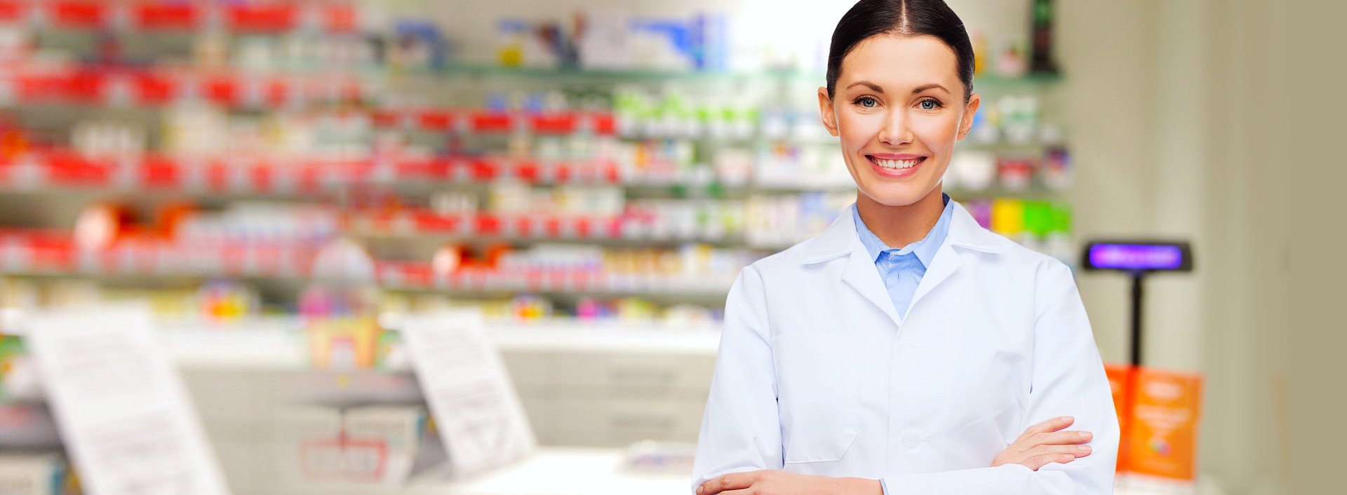 pharmacist smiling inside the drug store